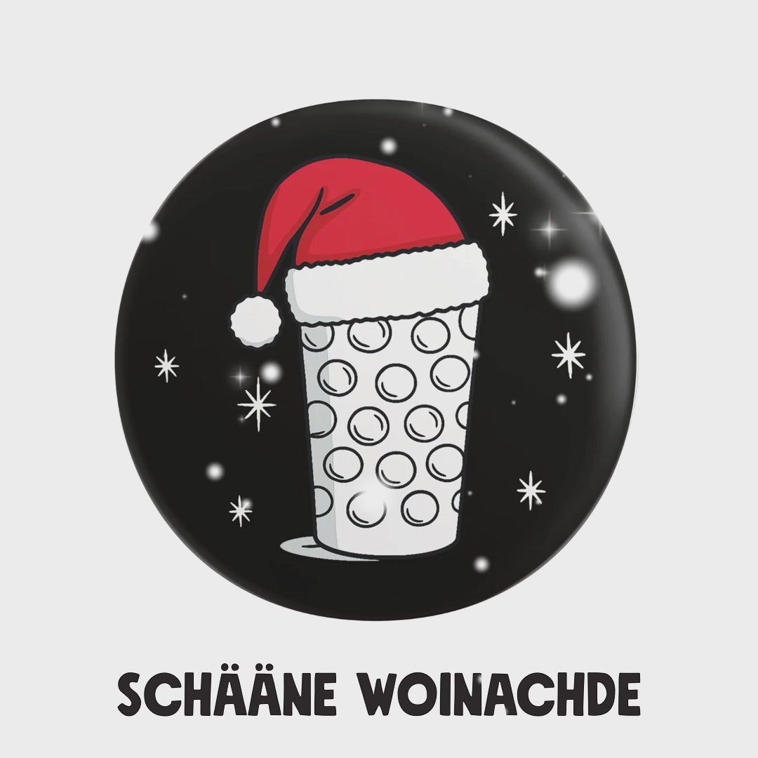 Schääne Woinachde mit diesem Button
Dubbeglas mit Weihnachtsmütze - Button Ø 25 mm